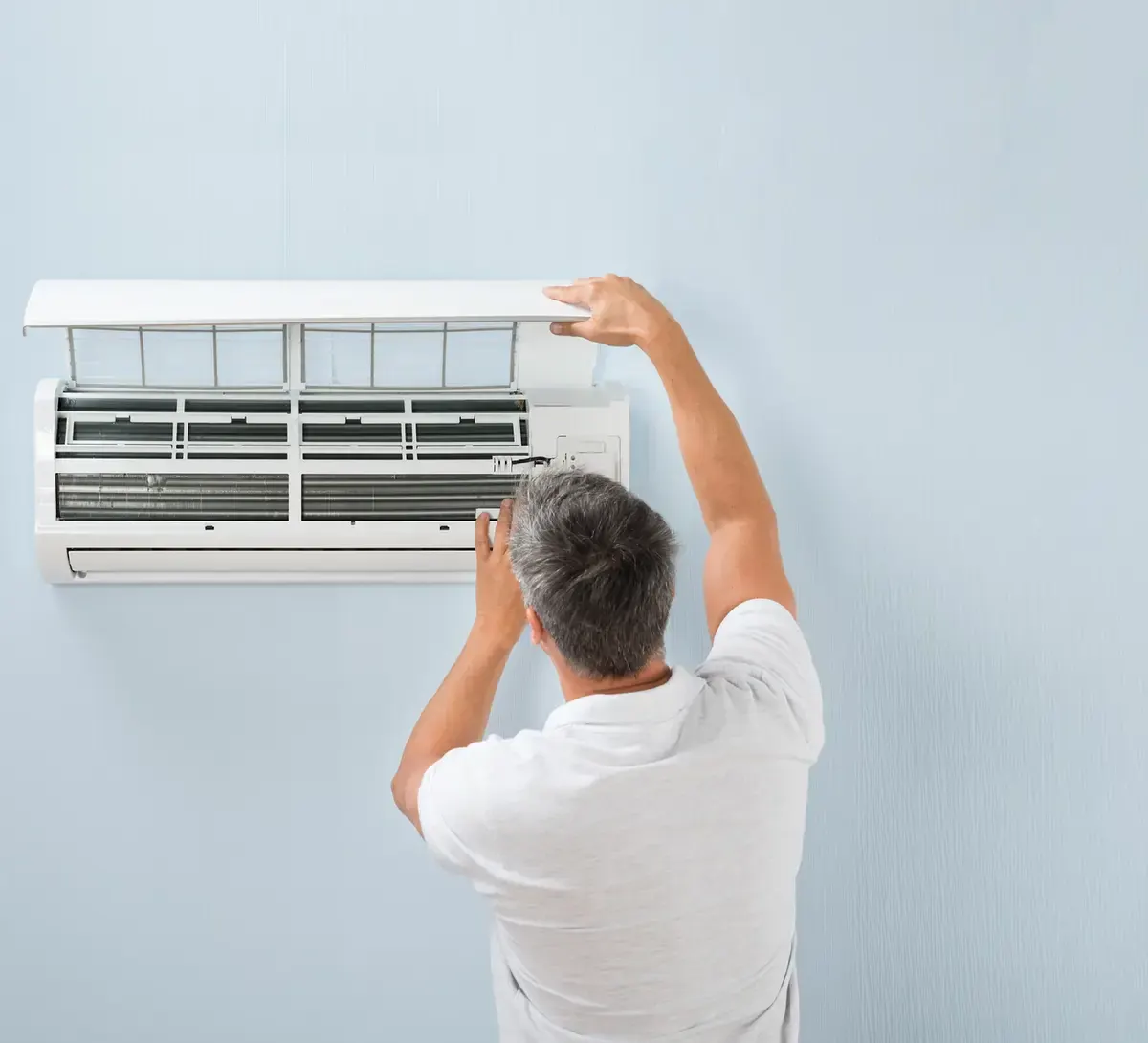 A1 Heat Pump Clean technician servicing a heat pump